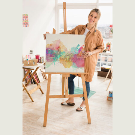 A person standing with a art work